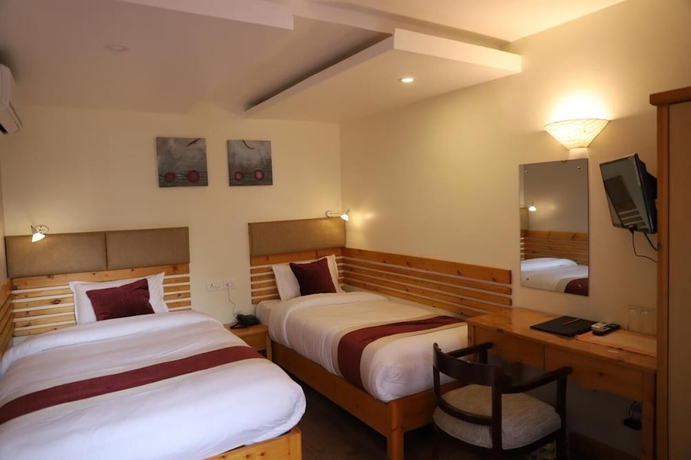 Imagen de la habitación del Hotel Nepal Cottage Resort. Foto 5