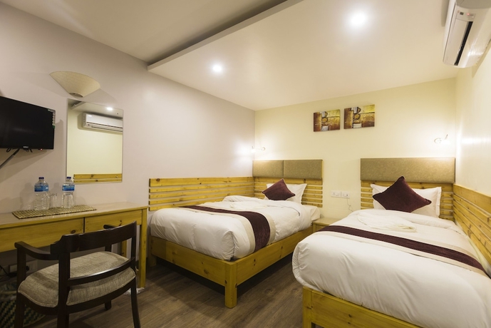 Imagen de la habitación del Hotel Nepal Cottage Resort. Foto 9