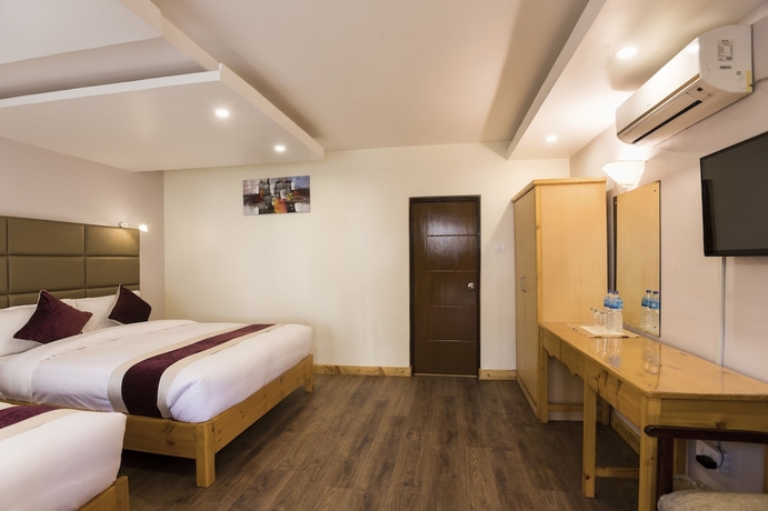 Imagen de la habitación del Hotel Nepal Cottage Resort. Foto 11