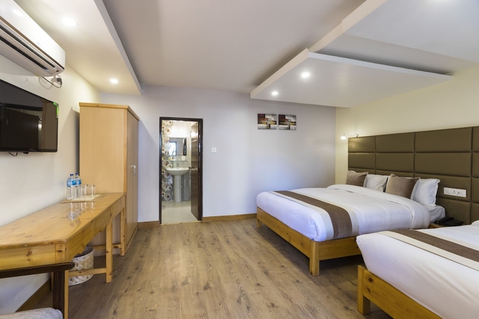 Imagen de la habitación del Hotel Nepal Cottage Resort. Foto 12