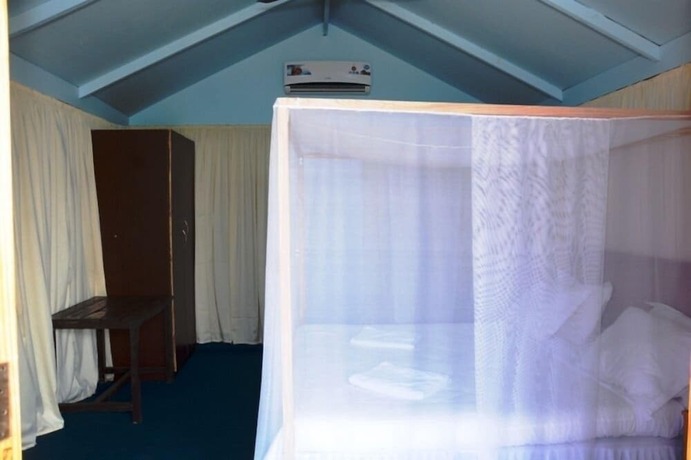 Imagen de la habitación del Hotel Neptune Point Beach Resort. Foto 16