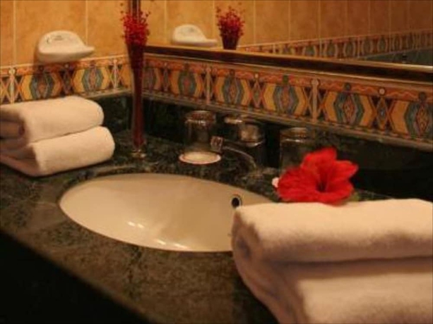 Imagen de la habitación del Hotel Nesima Resort. Foto 13