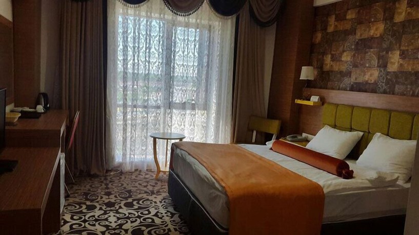 Imagen de la habitación del Hotel Nevan Suite. Foto 12