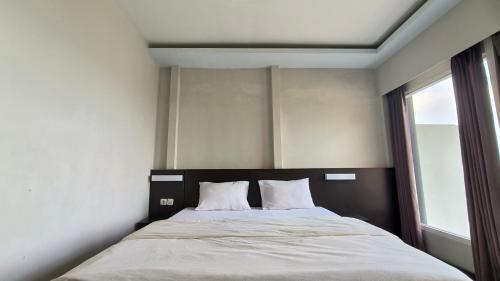 Imagen de la habitación del Hotel New Bandengan Beach. Foto 18