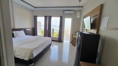 Imagen de la habitación del Hotel New Bandengan Beach. Foto 20
