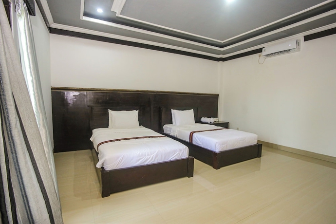 Imagen de la habitación del Hotel New Bintang Mandalika. Foto 4