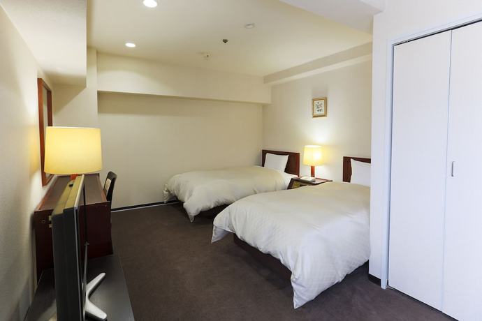 Imagen de la habitación del Hotel New Carina. Foto 4