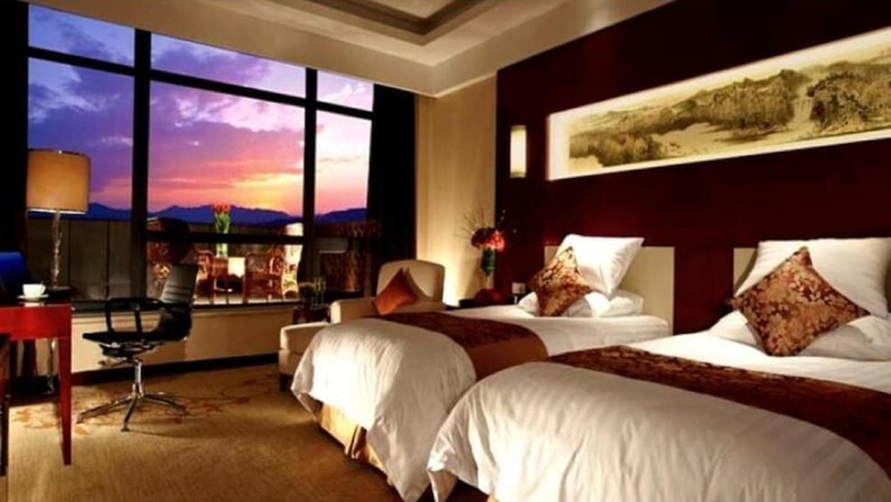 Imagen de la habitación del Hotel New Century Fengming Resort Zaozhuang. Foto 9