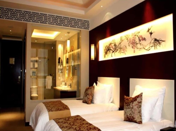 Imagen de la habitación del Hotel New Century Fengming Resort Zaozhuang. Foto 12