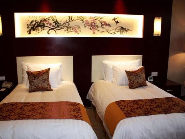 Imagen de la habitación del Hotel New Century Fengming Resort Zaozhuang. Foto 14