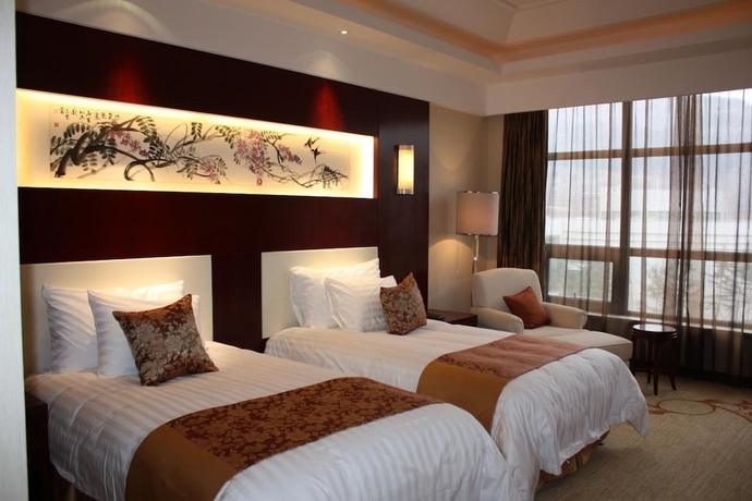Imagen de la habitación del Hotel New Century Fengming Resort Zaozhuang. Foto 17
