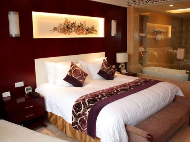 Imagen de la habitación del Hotel New Century Fengming Resort Zaozhuang. Foto 18