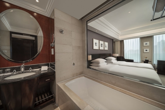 Imagen de la habitación del Hotel New Century Grand Hangzhou. Foto 4
