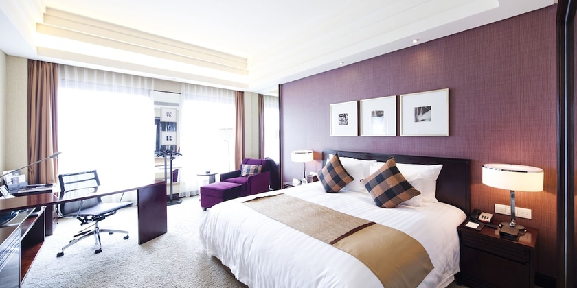 Imagen de la habitación del Hotel New Century Grand Hangzhou. Foto 5
