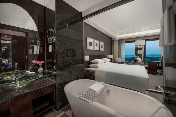 Imagen de la habitación del Hotel New Century Grand Hangzhou. Foto 6