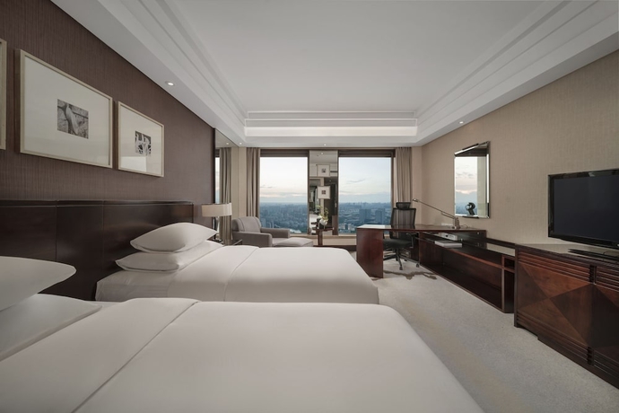 Imagen de la habitación del Hotel New Century Grand Hangzhou. Foto 8