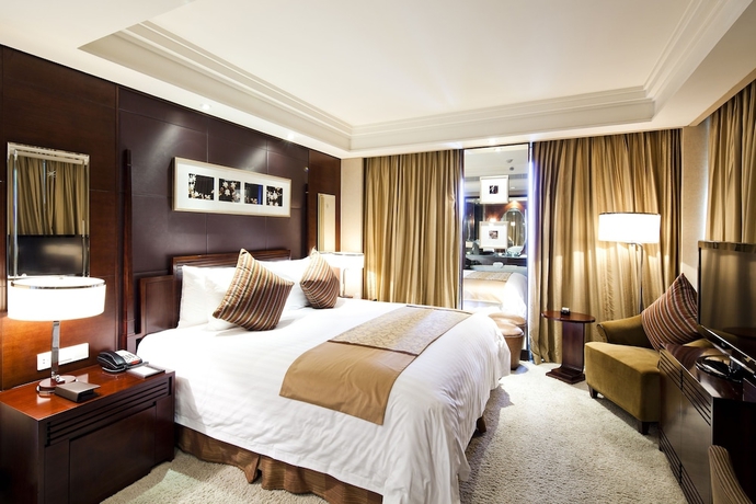 Imagen de la habitación del Hotel New Century Grand Hangzhou. Foto 13