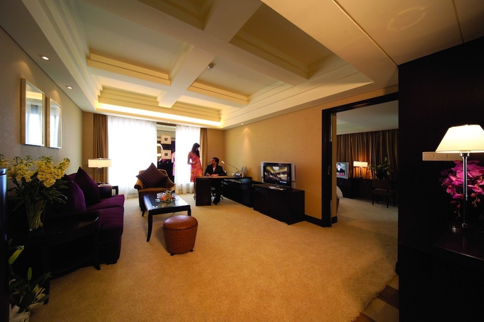 Imagen de la habitación del Hotel New Century Grand Hangzhou. Foto 14