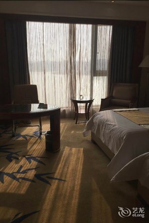 Imagen de los interiores del Hotel New Century Grand Hotel Huaian. Foto 19