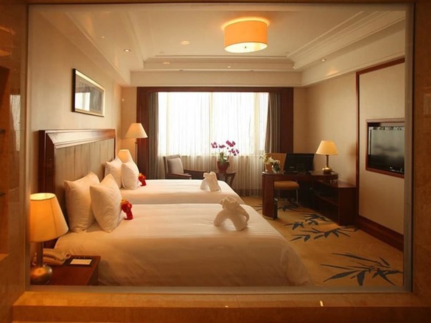 Imagen de la habitación del Hotel New Century Grand Hotel Huaian. Foto 15