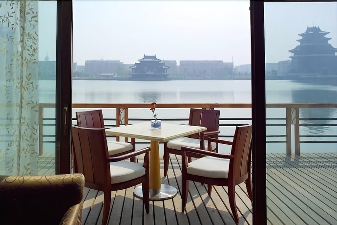 Imagen de la habitación del Hotel New Century Grand Kaifeng. Foto 11