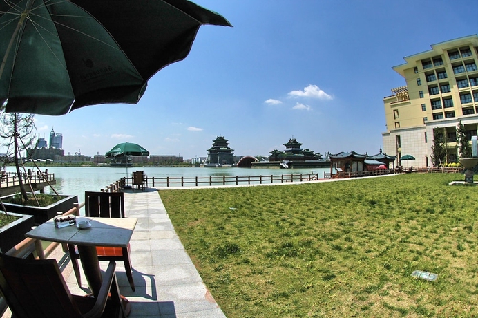 Imagen de la habitación del Hotel New Century Grand Kaifeng. Foto 12