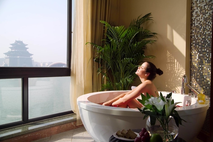 Imagen de la habitación del Hotel New Century Grand Kaifeng. Foto 13