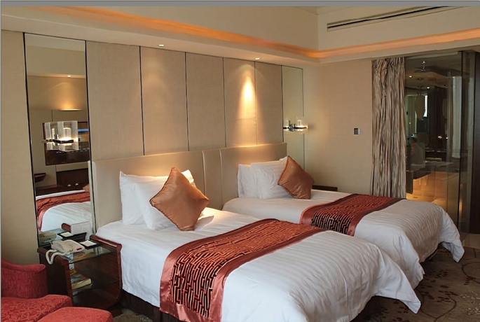 Imagen de la habitación del Hotel New Century Grand Tonglu Hangzhou China. Foto 6