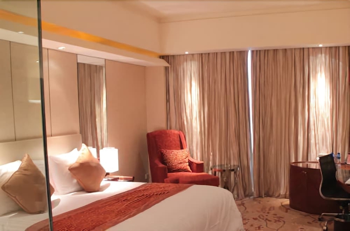 Imagen de la habitación del Hotel New Century Grand Tonglu Hangzhou China. Foto 8