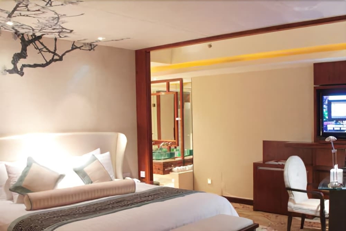 Imagen de la habitación del Hotel New Century Grand Tonglu Hangzhou China. Foto 9