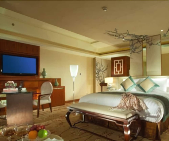 Imagen de la habitación del Hotel New Century Grand Tonglu Hangzhou China. Foto 10