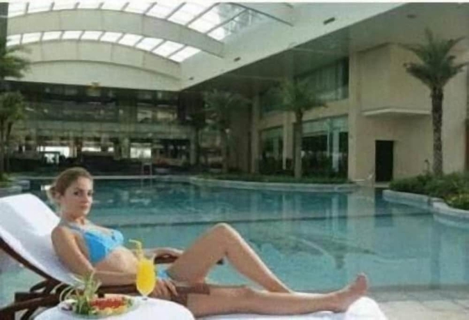Imagen de la piscina del Hotel New Century Grand Xuzhou. Foto 19