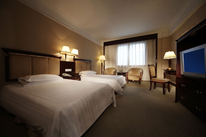 Imagen de la habitación del Hotel New Century Hotel Taizhou. Foto 3