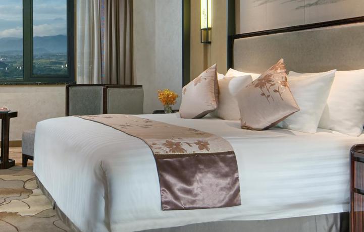 Imagen de la habitación del Hotel New Century Hotel Tiantai Zhejiang. Foto 4