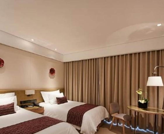 Imagen de la habitación del Hotel New Century Kylie Ningbo. Foto 3