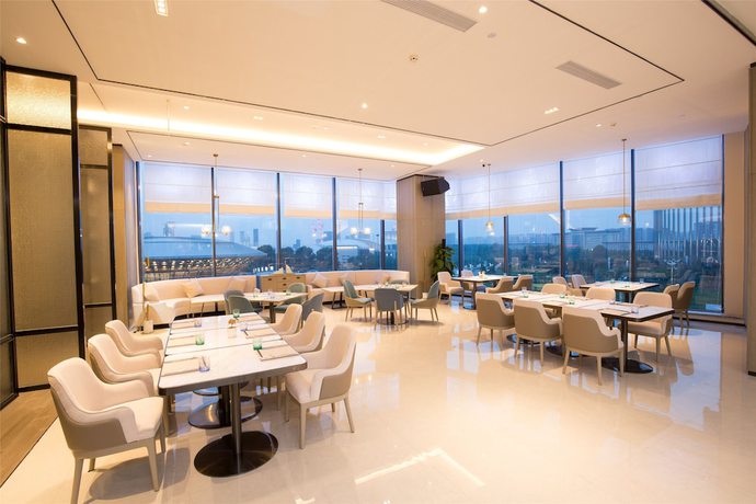 Imagen del bar/restaurante del Hotel New Century Life Changchun. Foto 3