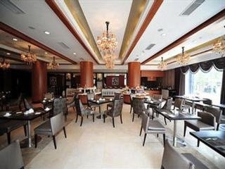 Imagen del bar/restaurante del Hotel New Century ManJu. Foto 6