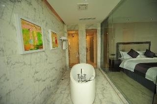 Imagen de la habitación del Hotel New Century ManJu. Foto 11