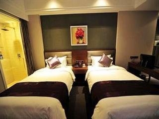 Imagen de la habitación del Hotel New Century ManJu. Foto 12
