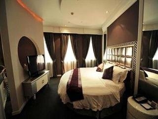 Imagen de la habitación del Hotel New Century ManJu. Foto 13