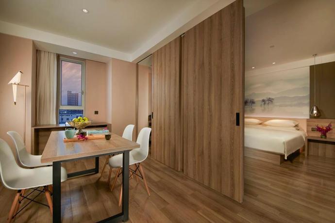 Imagen de la habitación del Hotel New Century Manju Hotel Wanda Plaza Minhang. Foto 3