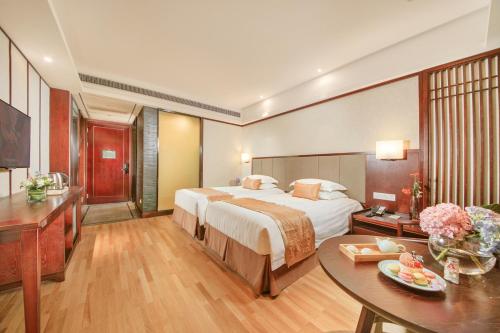 Imagen de la habitación del Hotel New Century Manju Liangzhu Hangzhou. Foto 7