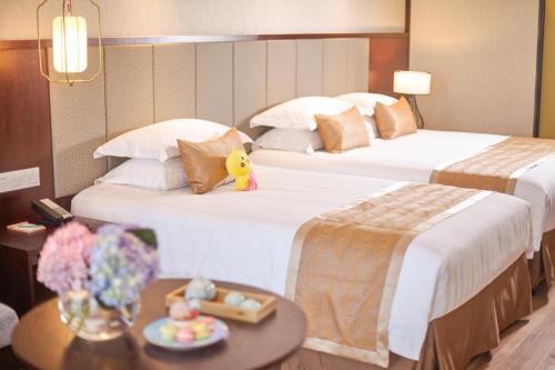 Imagen de la habitación del Hotel New Century Manju Liangzhu Hangzhou. Foto 9