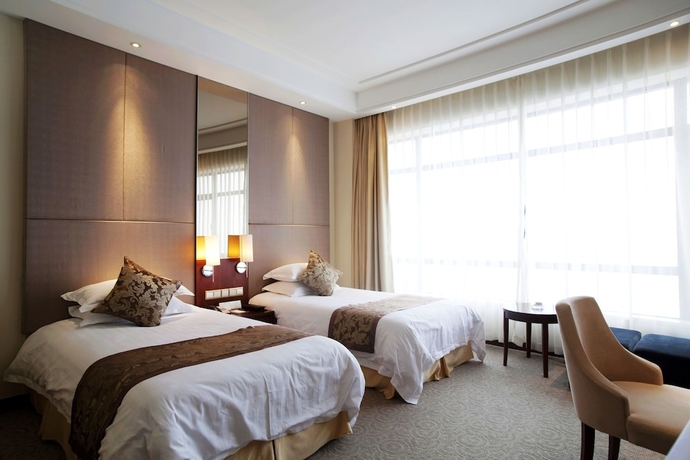 Imagen de la habitación del Hotel New Century Qiandao Longting. Foto 6