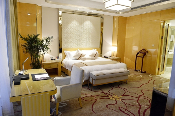 Imagen de la habitación del Hotel New Century Yiwu. Foto 5