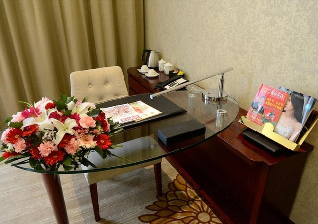 Imagen de la habitación del Hotel New Century Yiwu. Foto 8