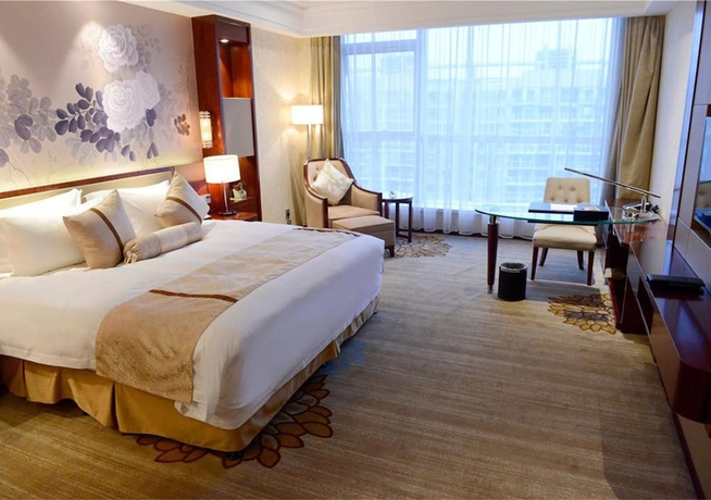 Imagen de la habitación del Hotel New Century Yiwu. Foto 9