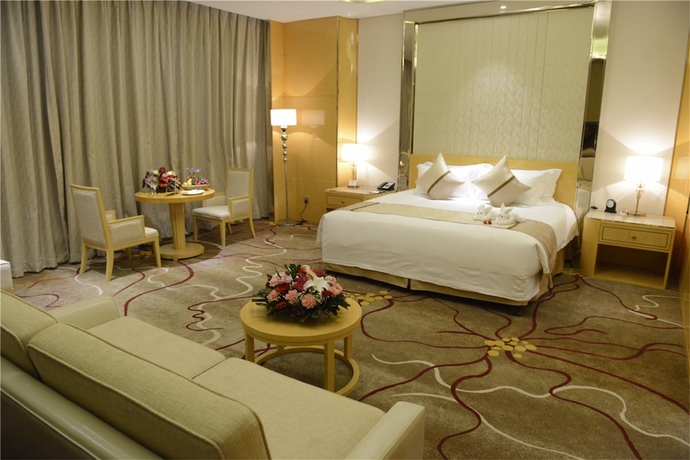 Imagen de la habitación del Hotel New Century Yiwu. Foto 11