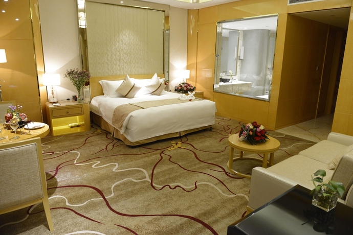 Imagen de la habitación del Hotel New Century Yiwu. Foto 12