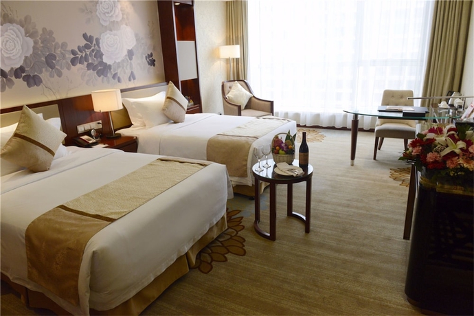 Imagen de la habitación del Hotel New Century Yiwu. Foto 13